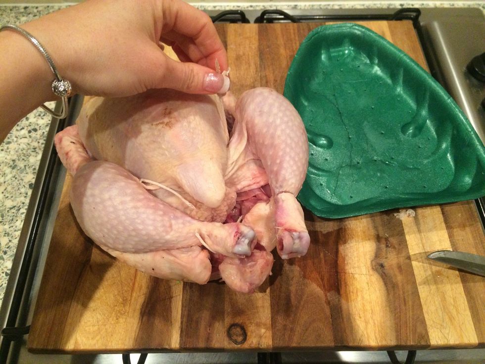 Take packaging and string off chicken