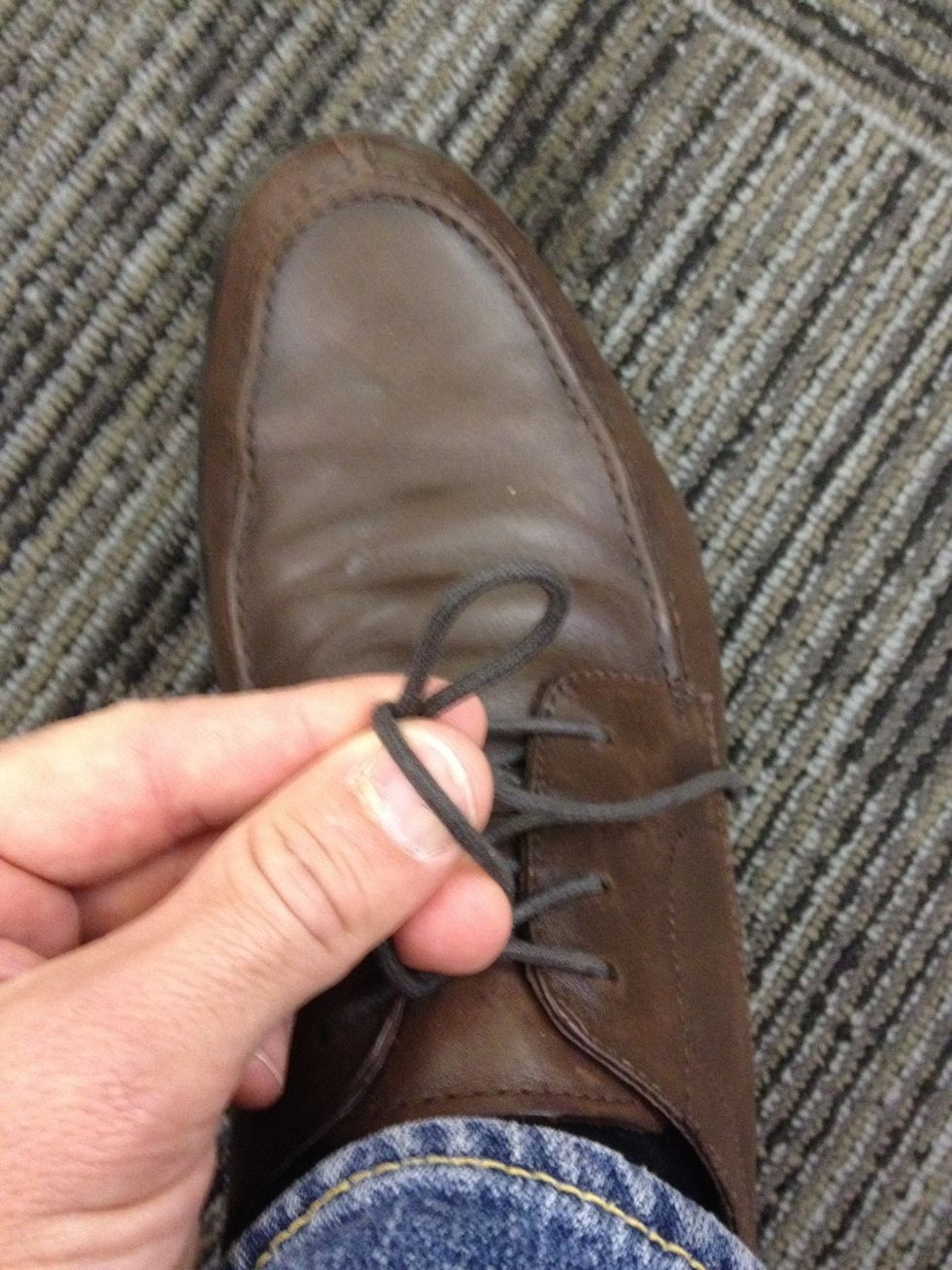 Take right lace and wrap over and around loop