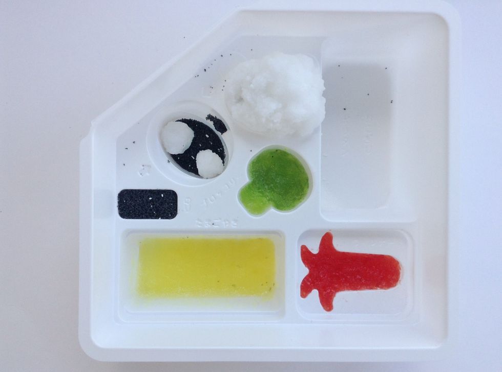 Take Round Large Rice Ball and Lay on Panda Face Mold-press firmly, but do not squish --Take the 2 Tiny Rice Balls you made for Panda's Ears and roll into oval spot with left over Black Powder