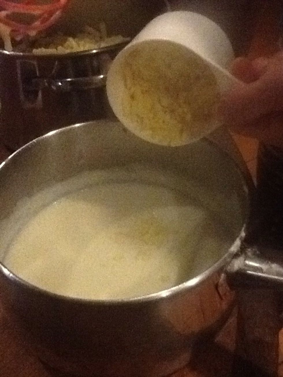 Take sauce off heat and add grated cheese than  stir