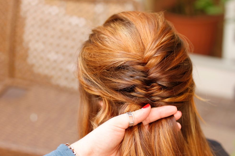 Take slightly thinner pieces of hair from the side that you want the braid to sweep to. See how the braid is starting to shape to the left side?