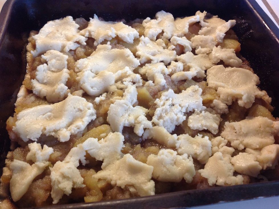 Take small amounts of remaining dough, flatten slightly and place over the pie filling. (It will not cover the pie filling completely.)