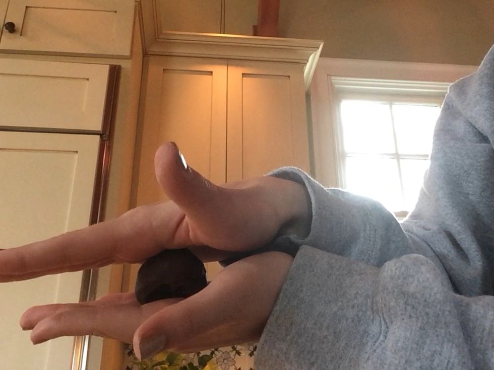 Take small pieces of the dough and roll them into balls between your hands.