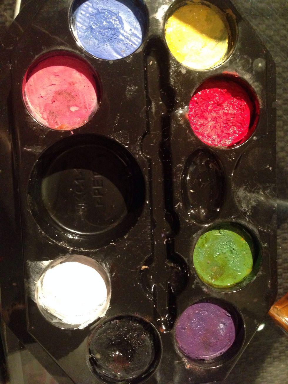 Take som face paint, any kind will do. Find one that fits your budget.