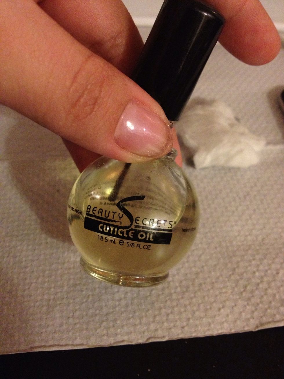 Take some cuticle oil and paint around your nail by the nail bed to soften the cuticle