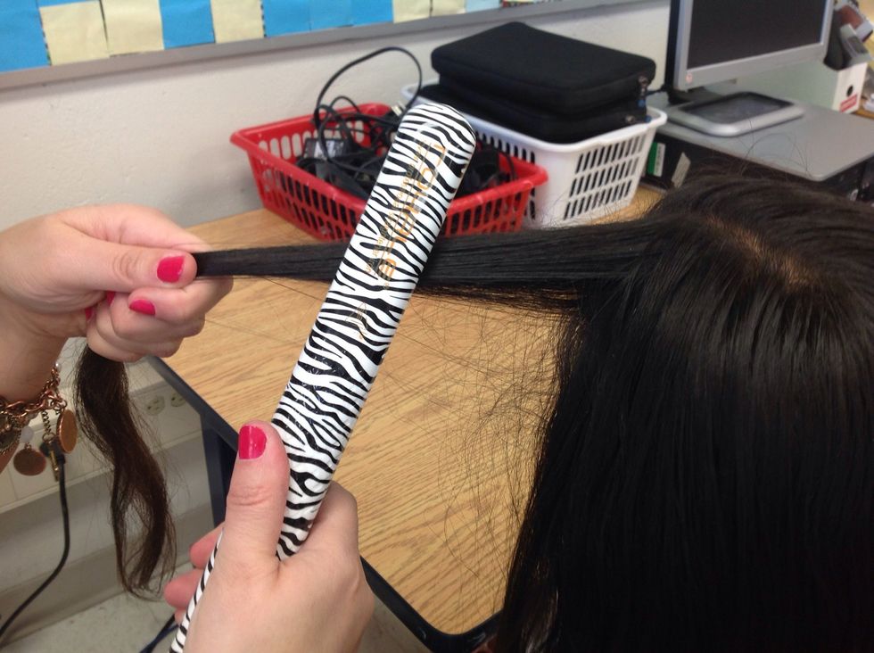 Take some hair,put it in the straightener and slide it down. The less hair you put, the easier it is to straighten.