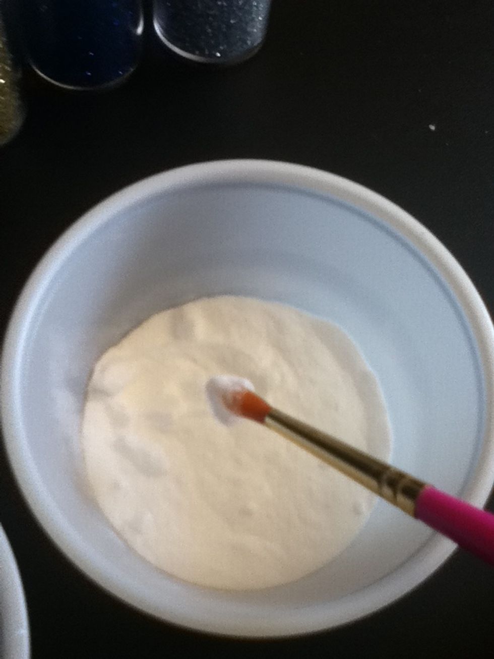 Take some more clear glue and roll it in the baking soda to just give the glue a light dusting