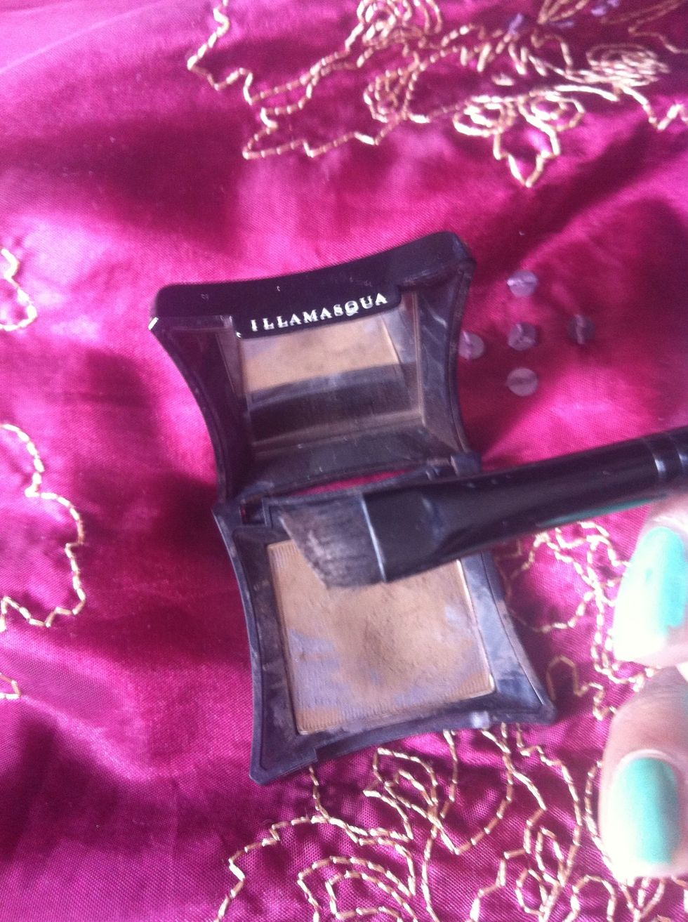 Take some onto the eyebrow brush