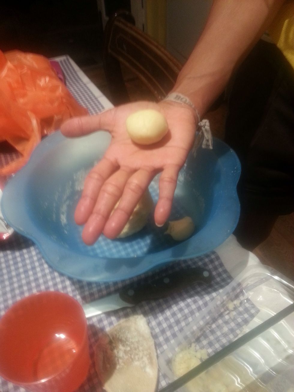 Take some pastry into your hands and roll into little balls