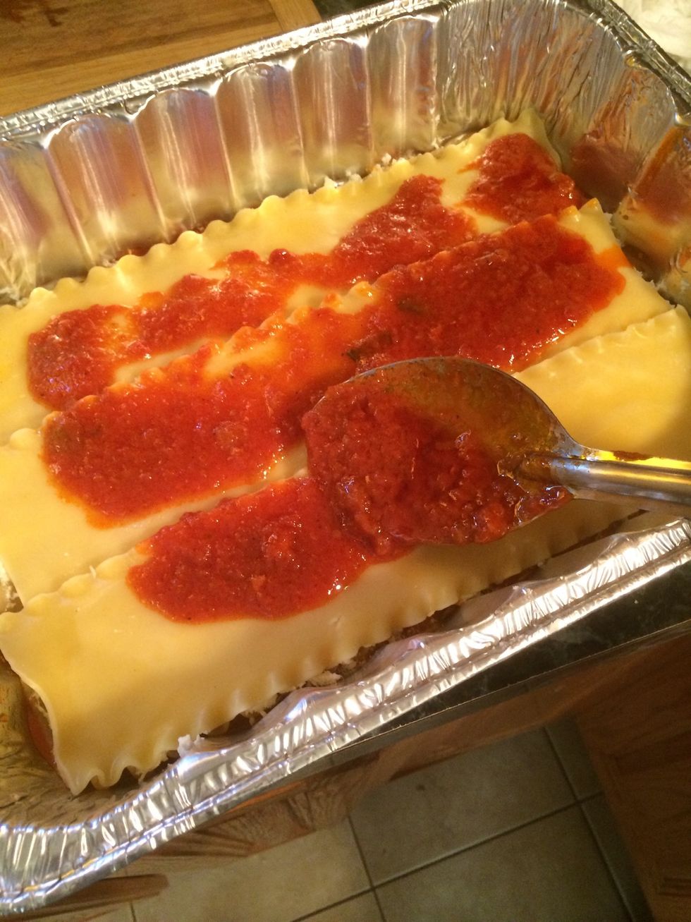 Take some sauce and slather it over the noodles generously