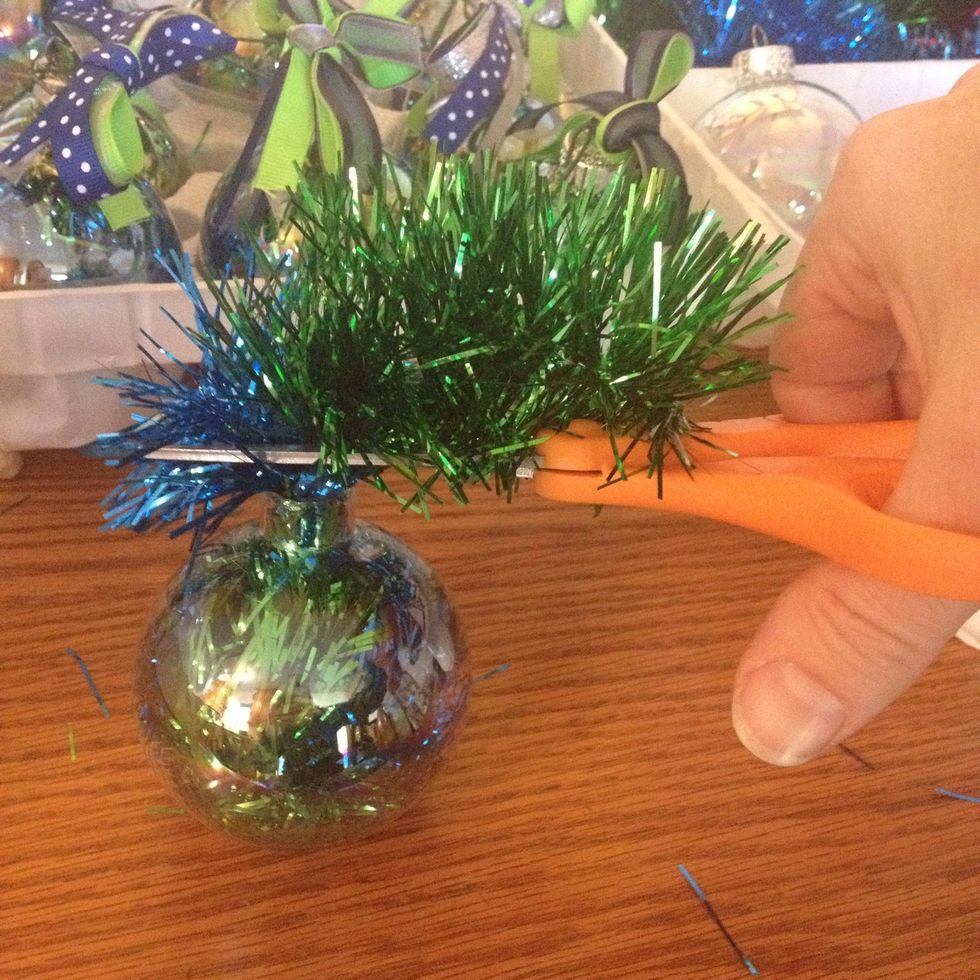 Take some scissors and cut the excess off.