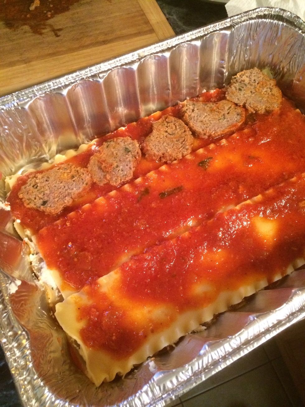 Take some sliced meatballs and spread them on each noodle. I managed to put one whole sliced meatball on each noodles. I used meatballs for this layer.