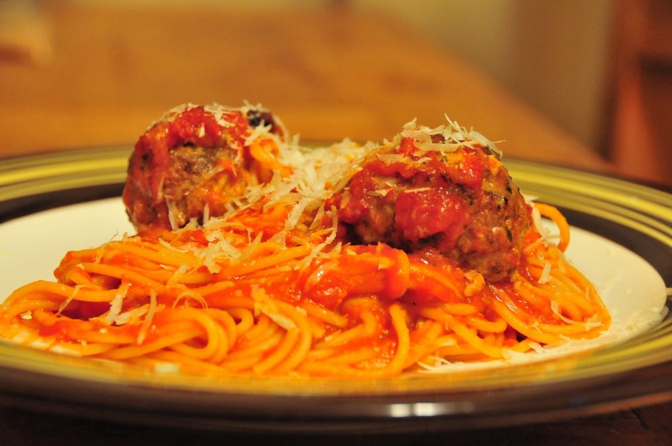 Take some spaghetti, 2 meatballs, and some of our tomato sauce (recipe on snap guide).  Cook pasta al dente, toss with sauce and meatballs. Sprinkle on some freshly grated Parmesan.