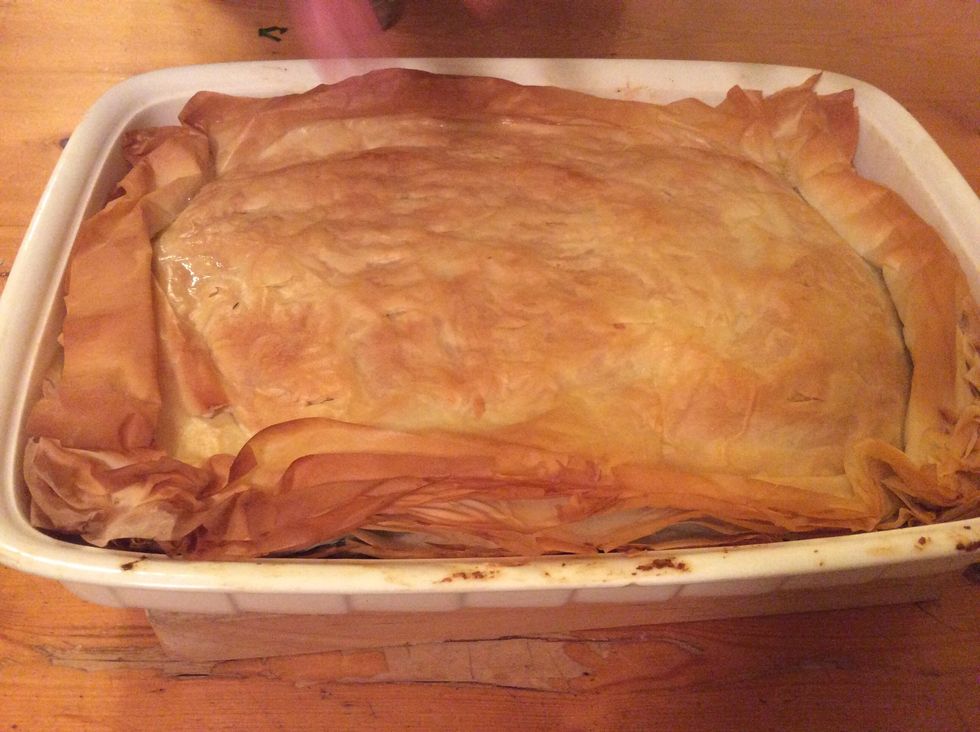 Take spanakopita out of oven and let it cool for 15 minutes or until it is ready to serve.