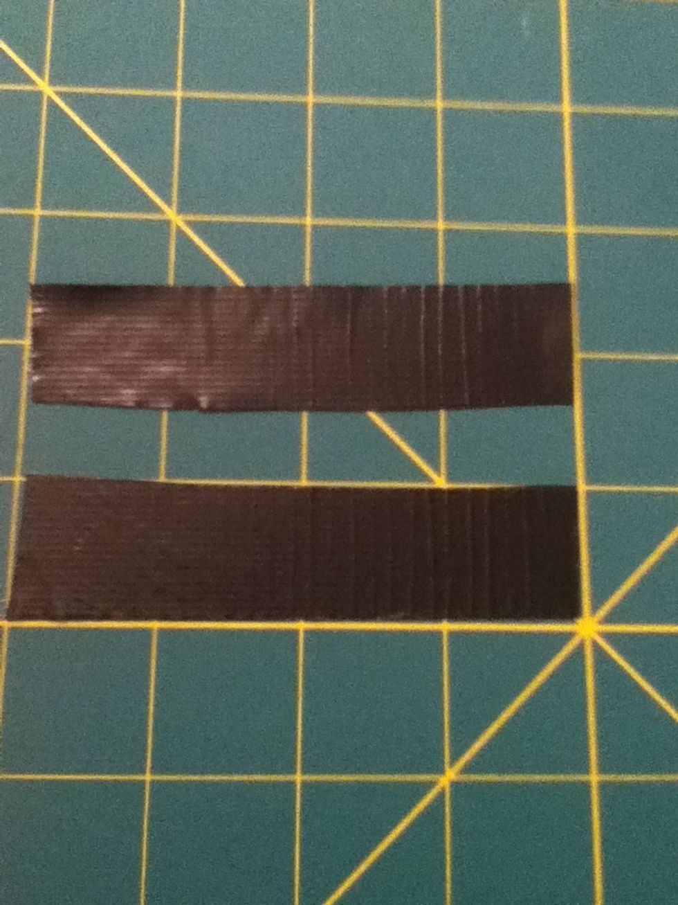Take that black piece and cut it in half long ways.