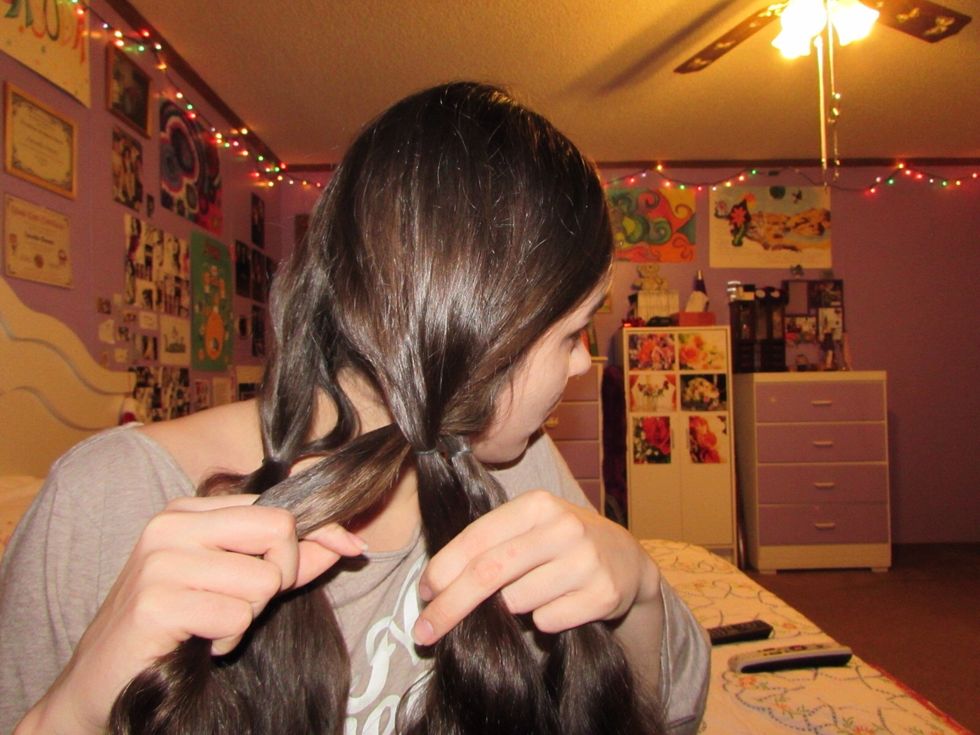 Take that strand and put it under the left-most inner strand. DO NOT TWIST!