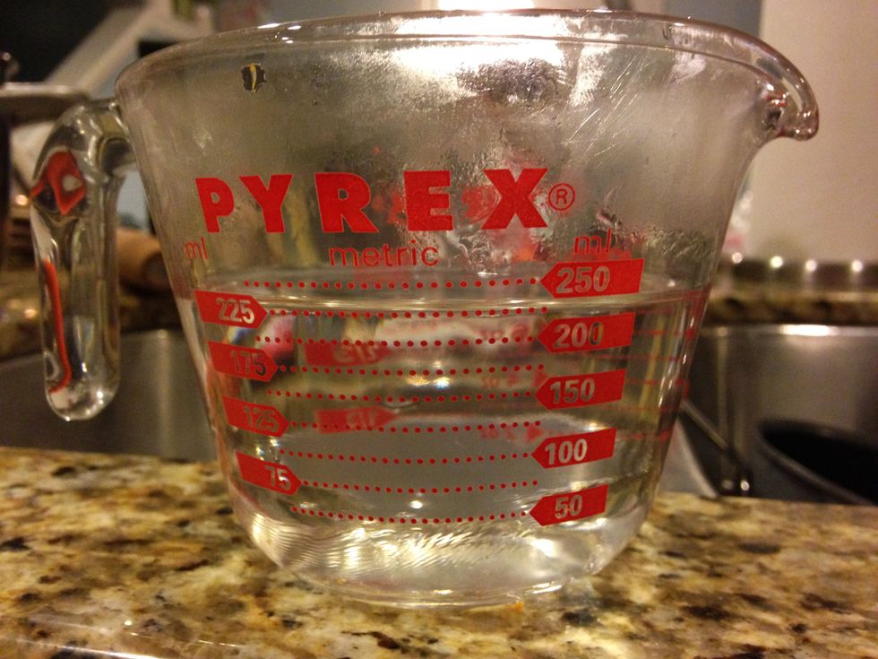 Take the 1 cup of water and pour it into the pot.