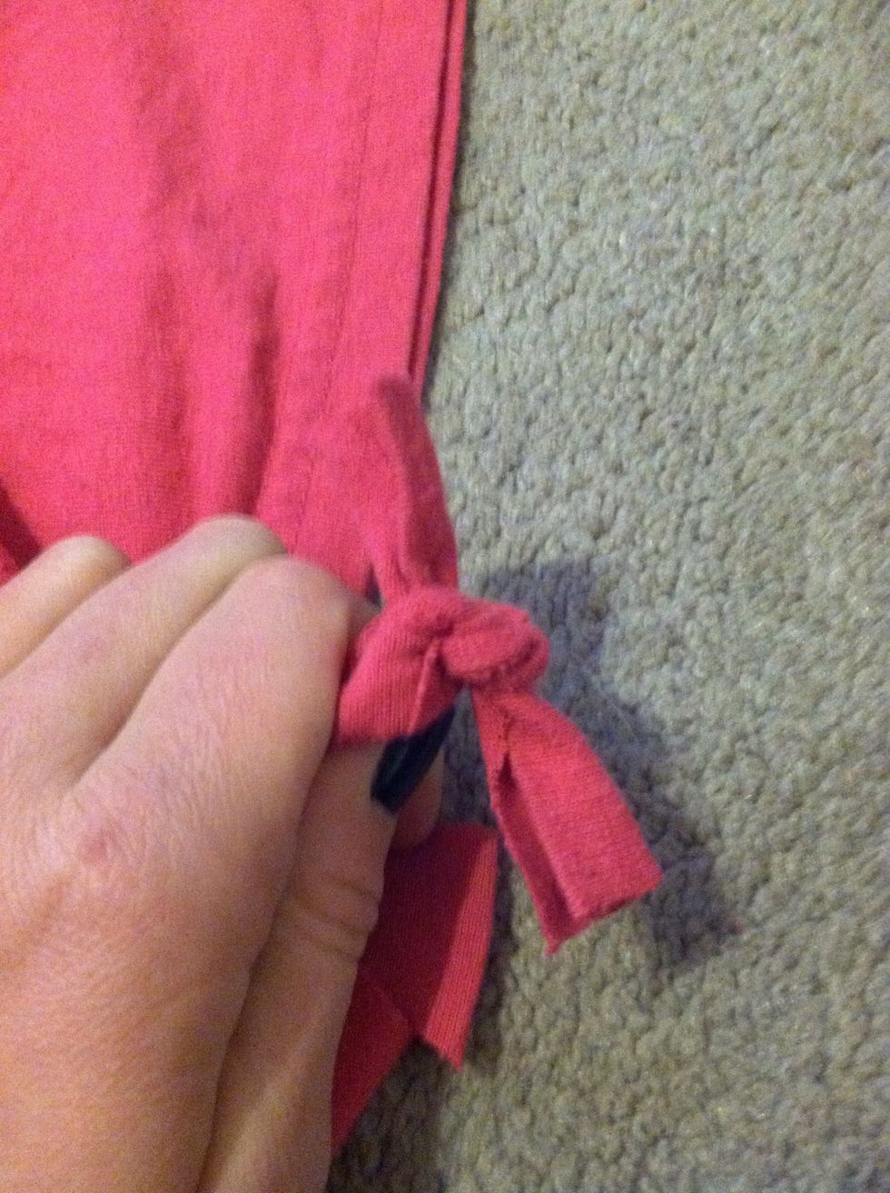 Take the 2 pieces of cloth and tie it in a knot (double knot it so it doesn't come out in the wash)