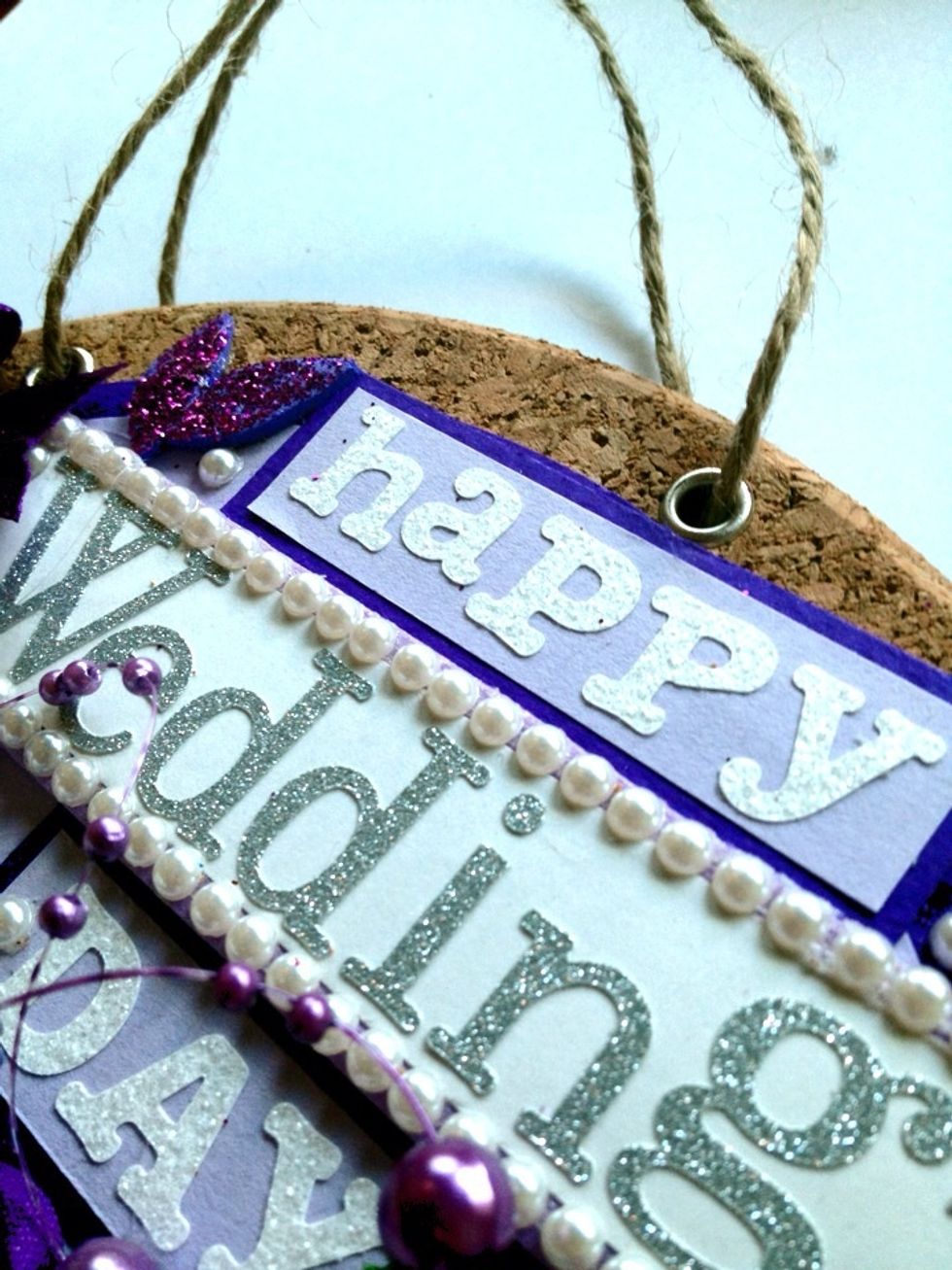 Take the alphabet stickers and make your own message. Decorate. Its up to your creativity. I use eyelet and string so we can hang this on the wall.