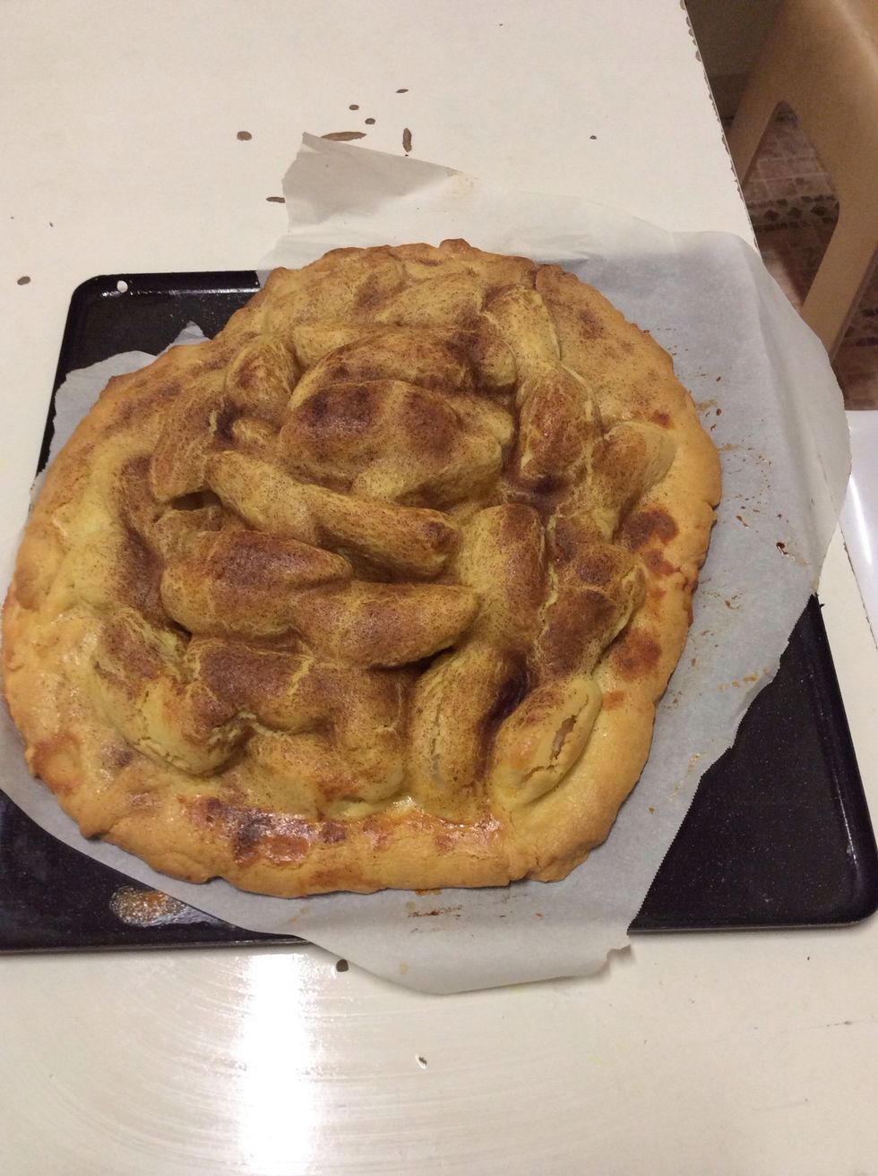 Take the apple pie out of the oven once it looks golden-brown. Make sure you put it on a surface which isn't going to get burnt.