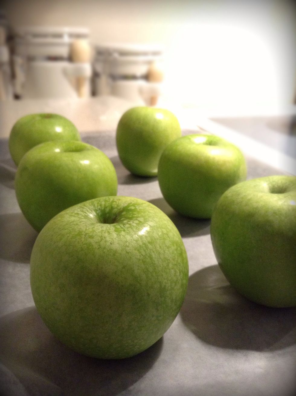 Take the apples from the freezer, place on a baking sheet lined with parchment paper. It is important you use parchment paper or waxed paper without it your apples will stick and become a mess.