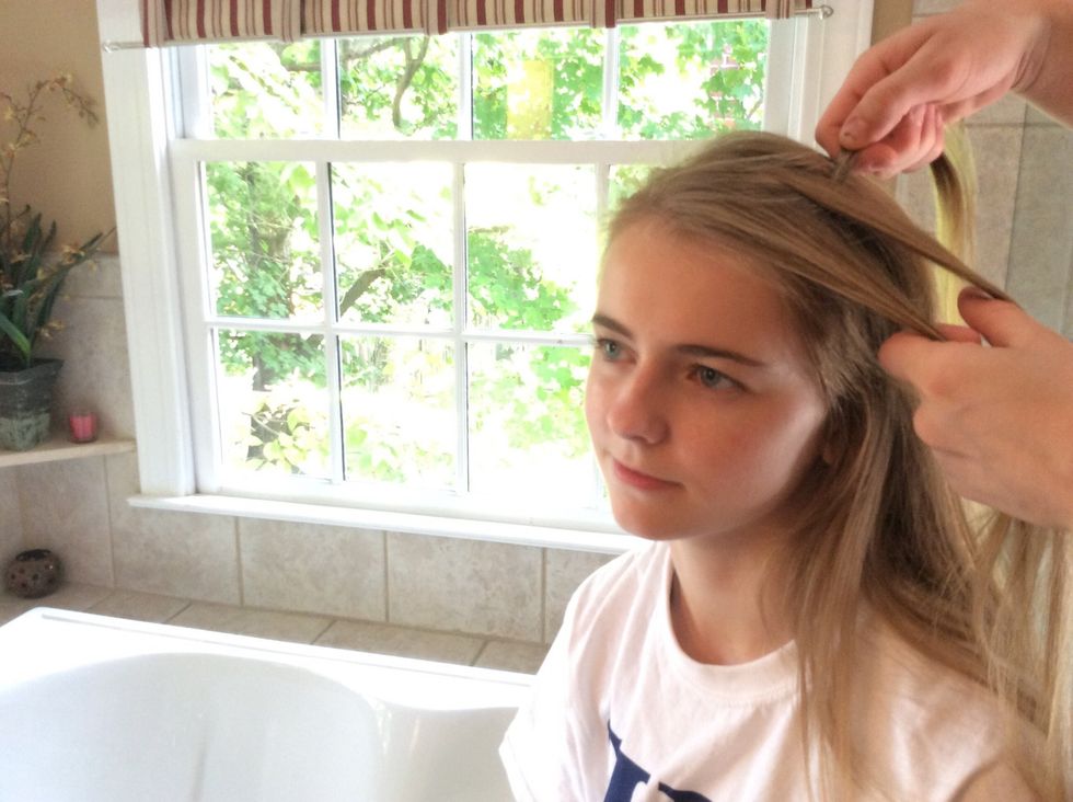 Take the back strand and cross it over the middle strand.