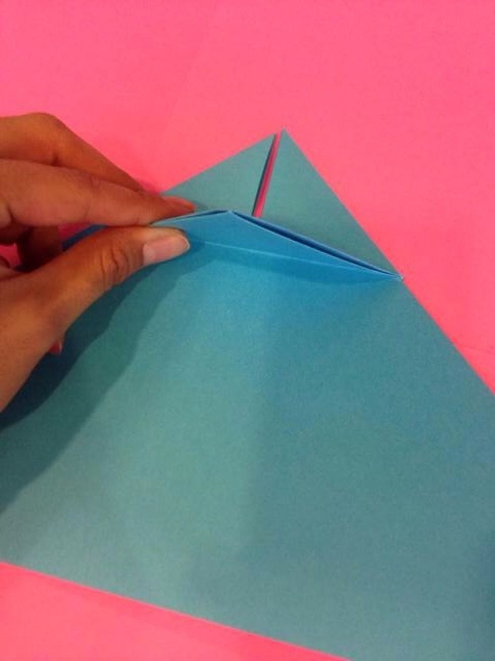 Take the back top and fold it towards the back