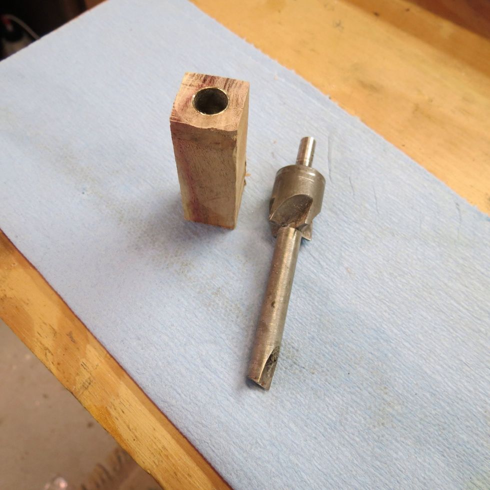 Take the barrel trimmer down to the brass tube, but don't remove much brass tube material. You want to maintain the original dimensions of the pen tube.