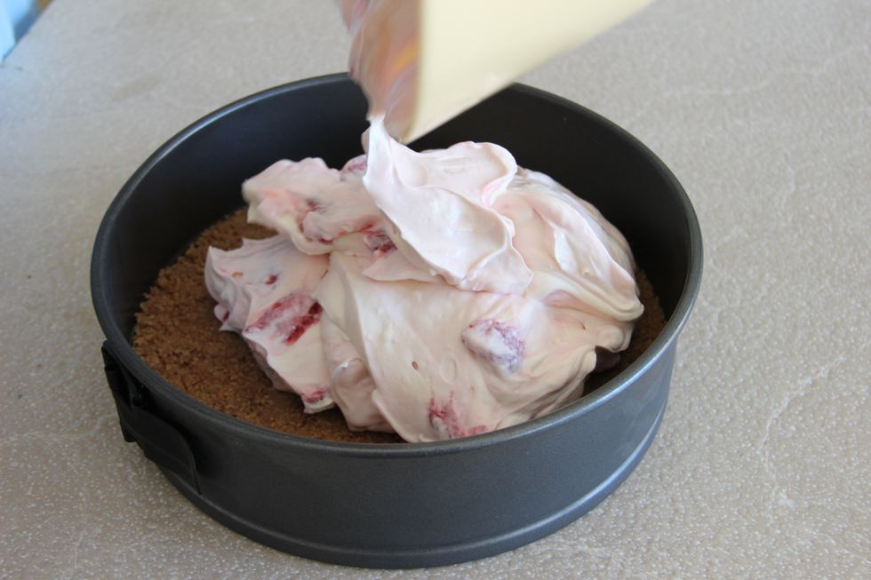 Take the base out of the fridge and add the filling