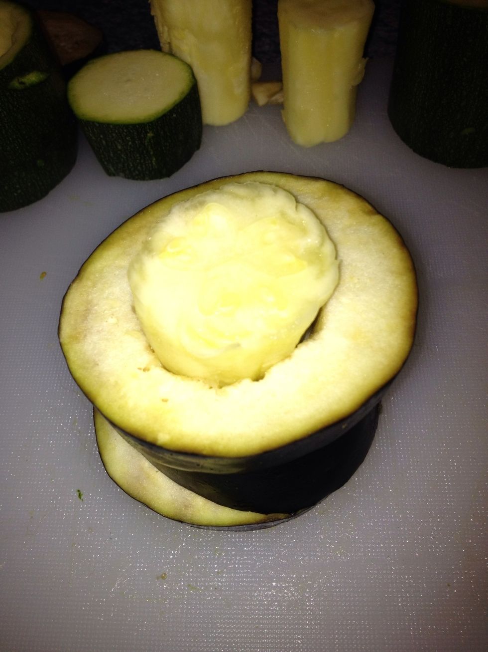 Take the biggest peace of zucchini and push it down the middle