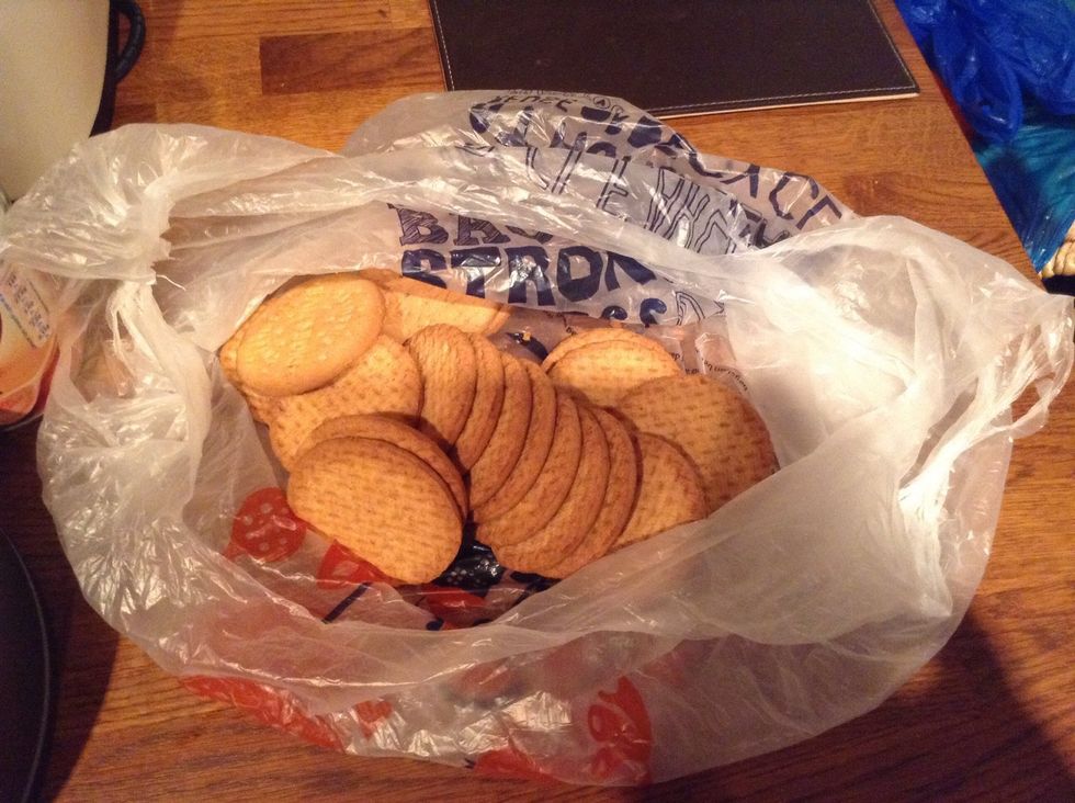 Take the biscuits and place then in a "clean" bag, then bash the living nonsense out of them