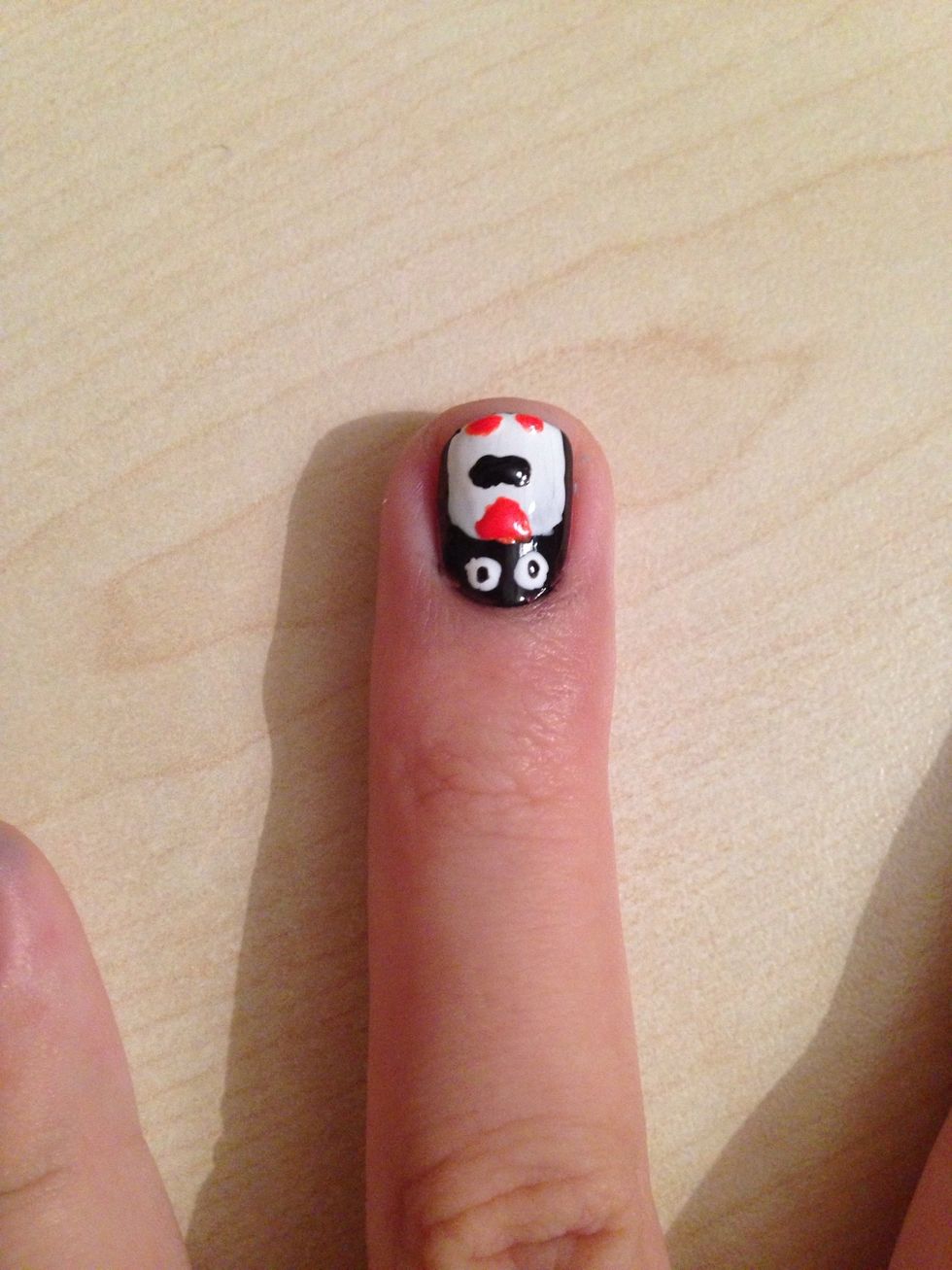 Take the black colour again and make a bow-tie (two touching dots)