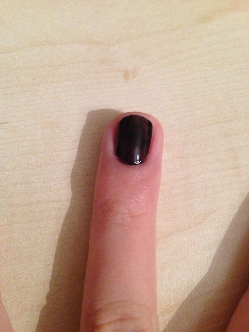 Take the black nailpolish and apply it only your ring finger