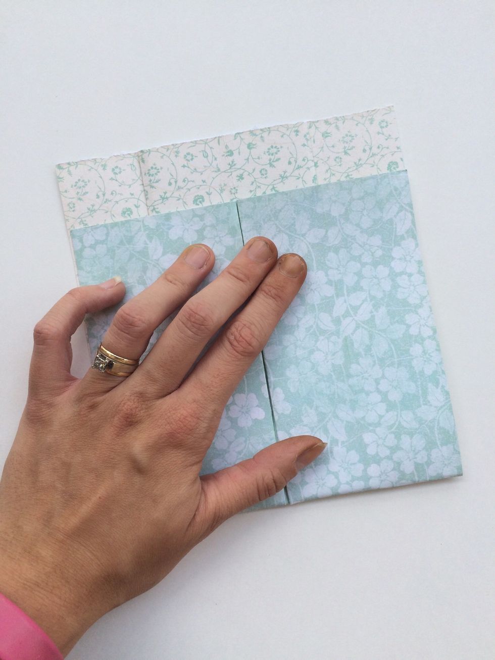 Take the bottom of your paper, and fold it up about 1 inch short of the top. If you are using a smaller paper, adjust this accordingly.