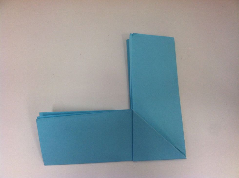 Take the bottom (or vertical) line and fold it upwards along the crease. You should have another backwards "L".