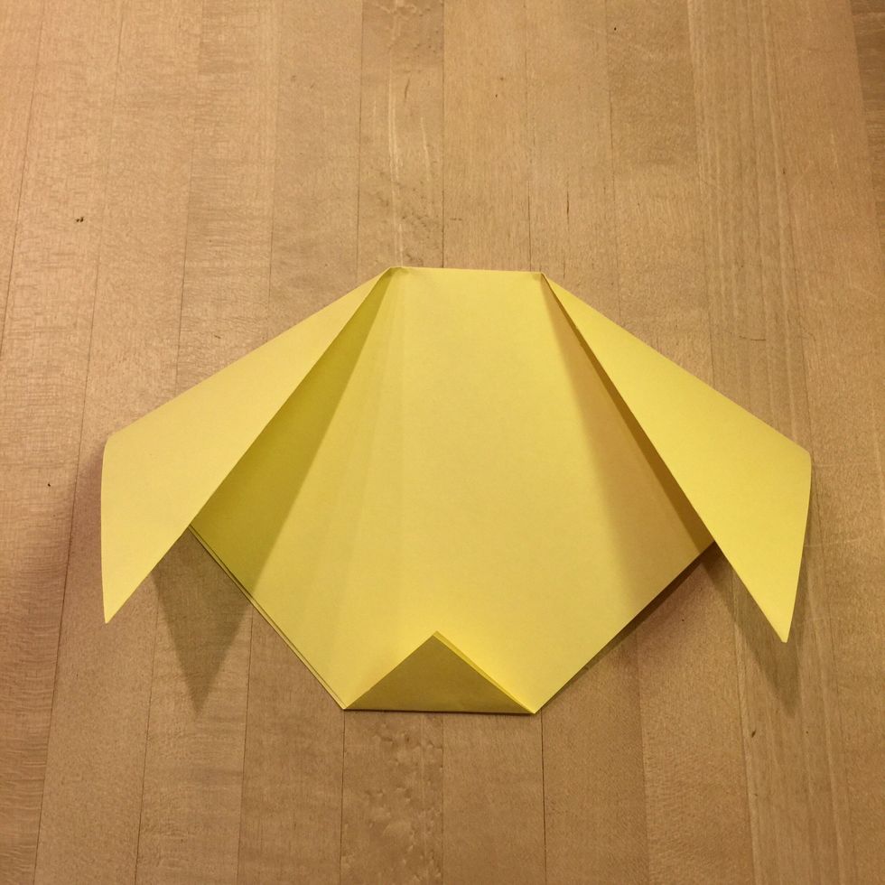 Take the bottom point and fold it upward so that it makes a small triangle.