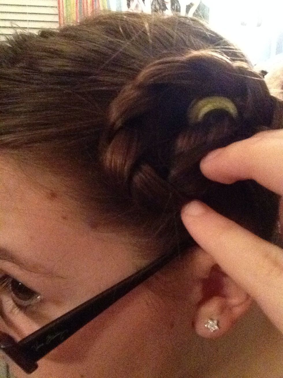 Take the braid and wrap It around the elastic band