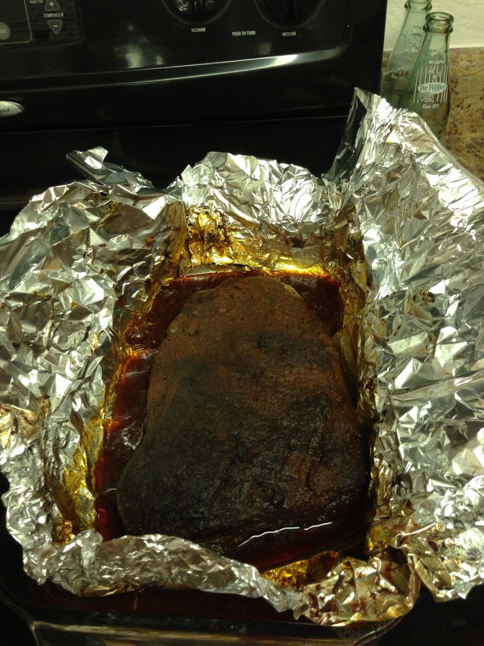 Take the brisket out of the oven. Yum! It looks pretty tasty.