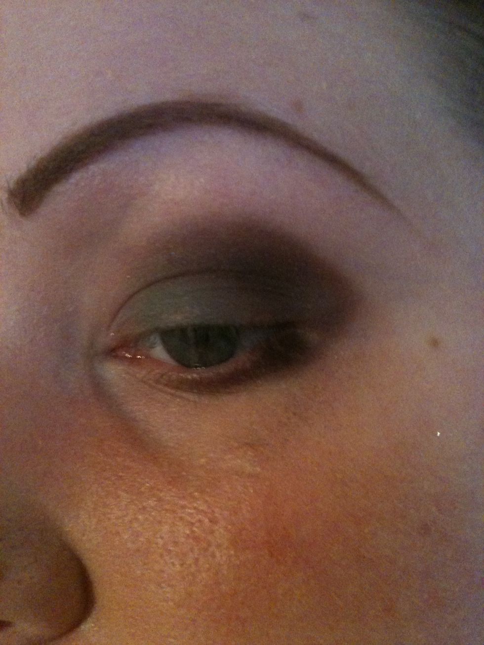 Take the brown and use it on the crease and lower lid. Either using your soft brush or a finger blend it well.