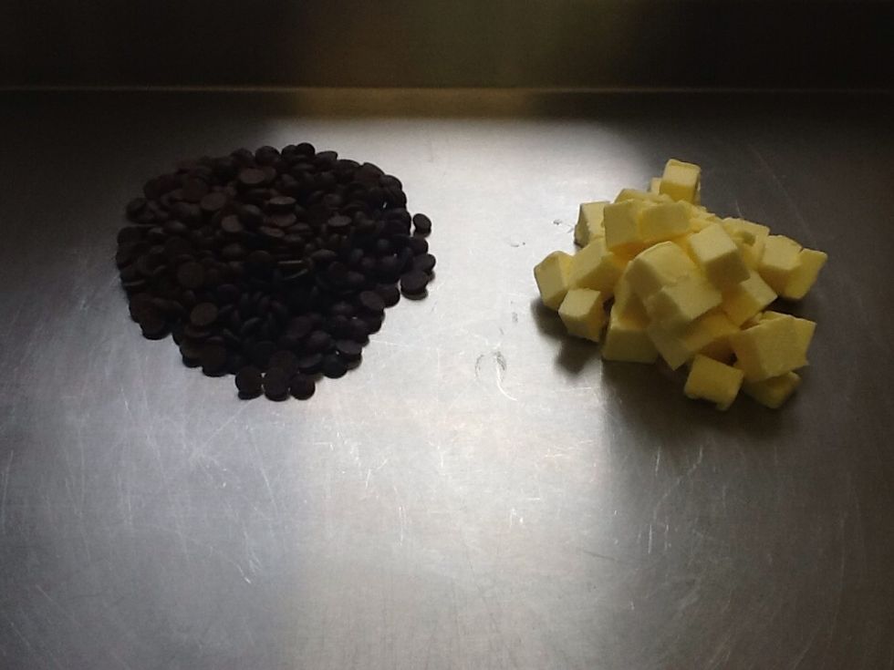 Take the butter and chocolate and put it into a bowl. Then get a saucepan and fill to about a quarter of the way with hot water and then put the bowl on top over the heat.