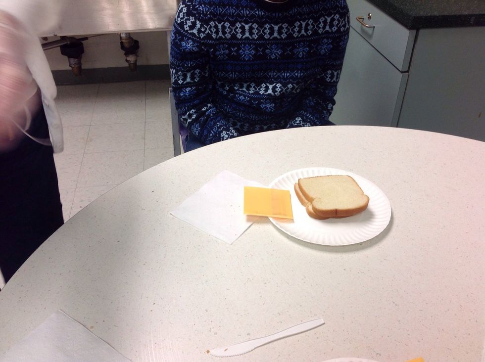 Take the cheese and 2 slices of bread