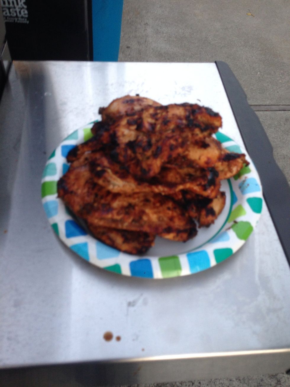 Take the chicken and onion mixture off the grill and lower the heat to low on the grill.