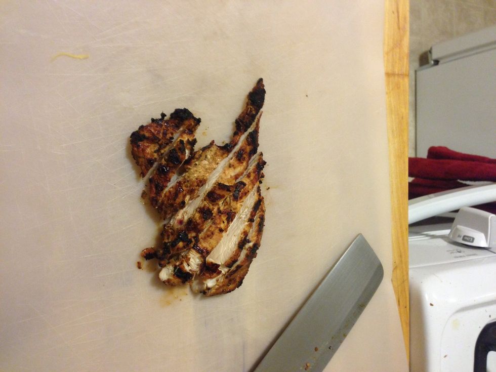 Take the chicken inside and cut it into slices. Yum. It's starting to look tasty.