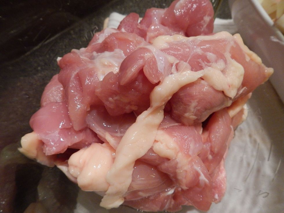 Take the chicken thighs out of the package and place in the container you will be marinating in