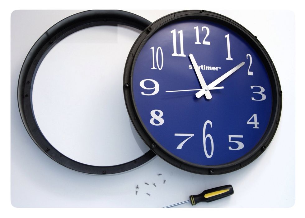 Take the clock apart, removing the glass face.