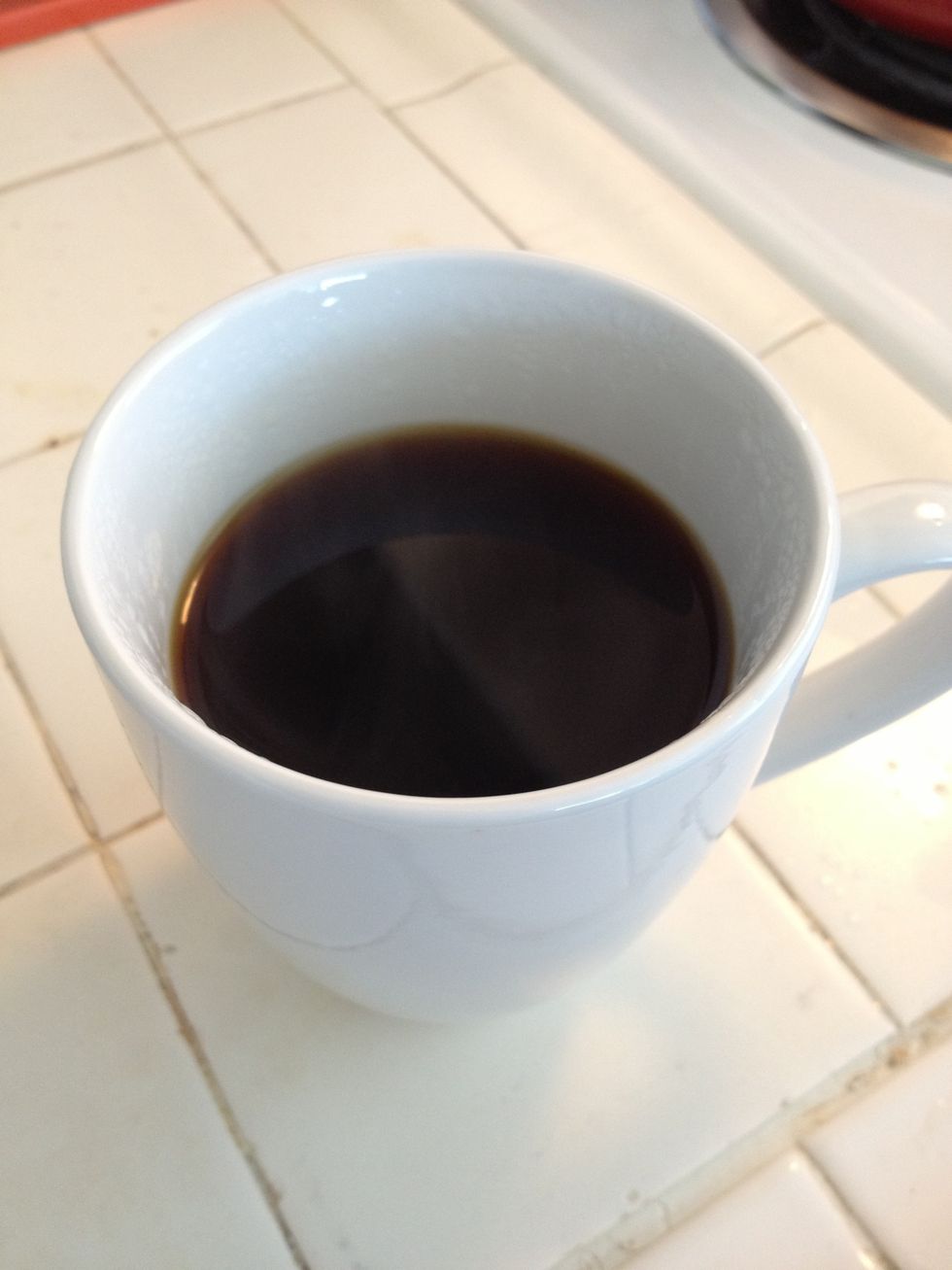 Take the cone off the mug and enjoy your delicious coffee.