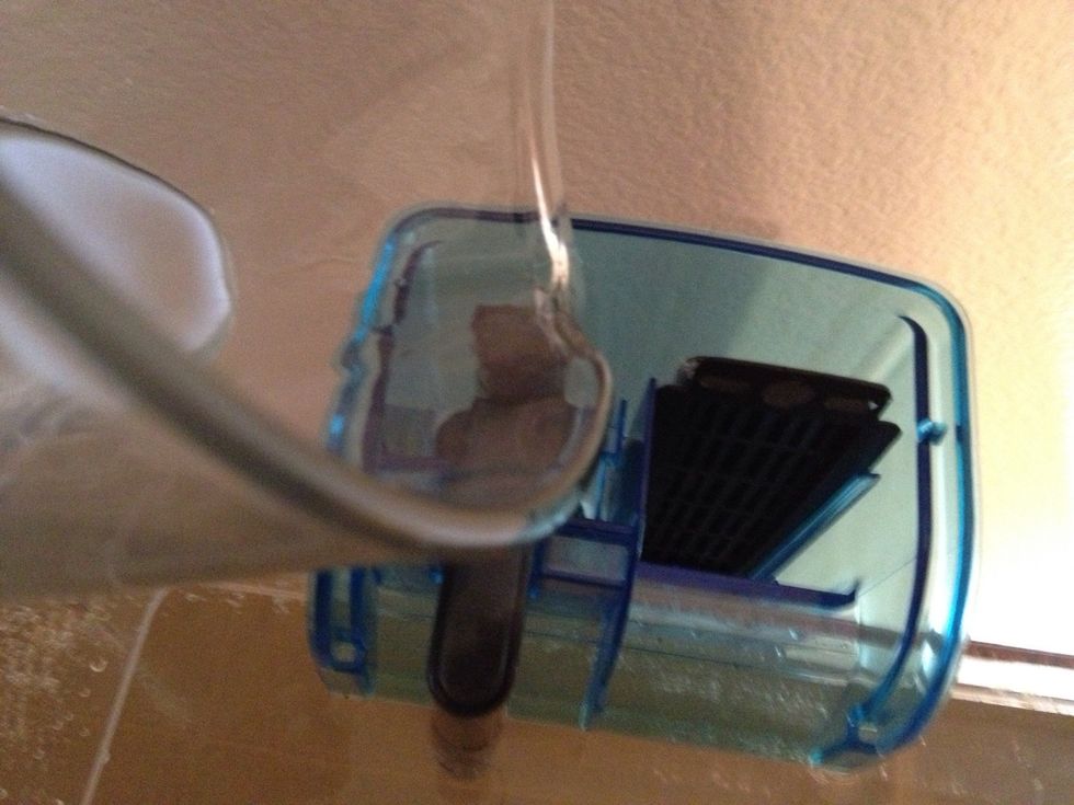 Take the cover off and add a little aquarium water to get it going.