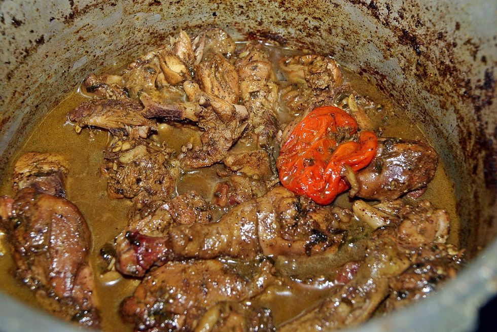 Take the cover off and allow liquid to bubble down to the desired amount of sauce. You can also burst the pepper at this point if you want some heat, leave it in for more spicey flavor or take it out.