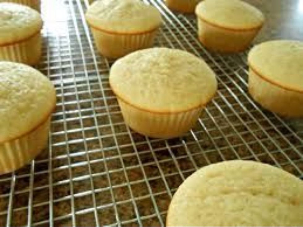 Take the cupcakes out when they have a brownish color around the outside of the top, then let them cool for five to fifteen minutes.
