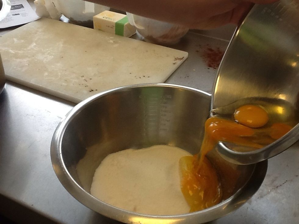 Take the eggs and golden caster sugar and whisk them together in a bowl.
